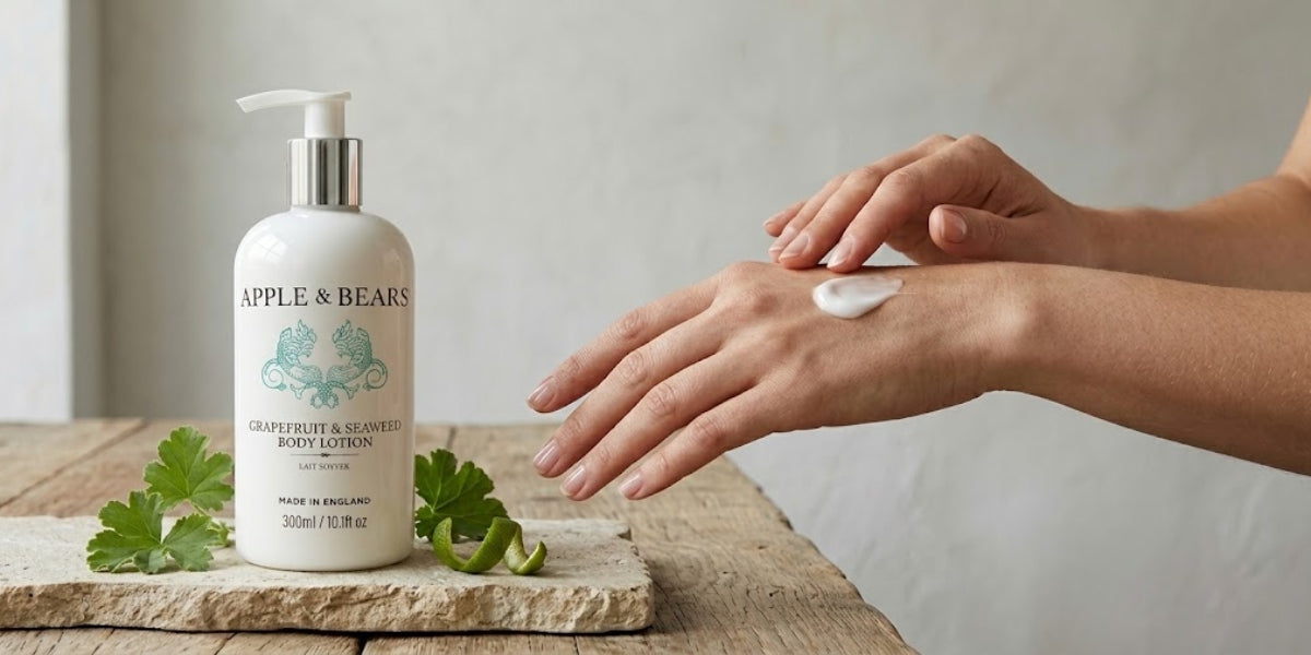 APPLE & BEARS Grapefruit & Seaweed Body Lotion 300ml with fresh botanicals on a wooden surface — lightweight body lotion with marine extracts and grapefruit fragrance, made in England.