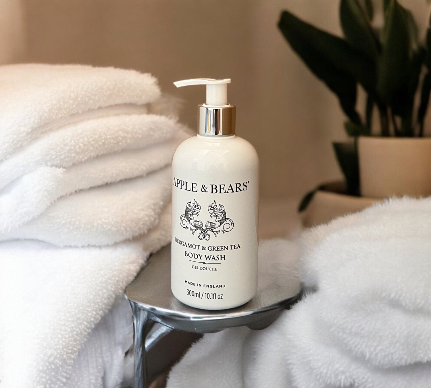 A premium product display showcasing an authentic full-sized 300ml Apple and Bears luxury certified organic Bergamot and Green Tea body wash bottle on a clean bathroom shelf.