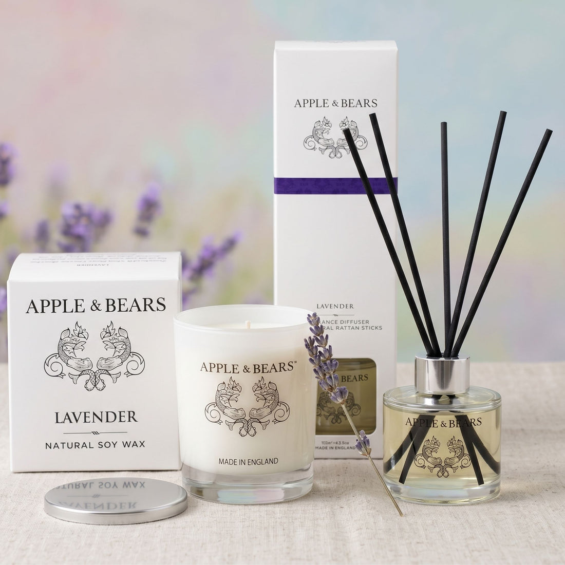 Apple &amp; Bears Lavender Sleep Sanctuary Home Gift Set featuring a luxury soy wax candle, 125ml reed diffuser with black reeds, and premium packaging accented with a sprig of fresh lavender.