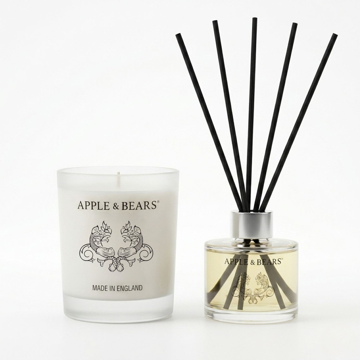 Apple &amp; Bears Sandalwood &amp; Pepper Home Gift Set featuring a 220g natural soy wax candle and a 125ml reed diffuser with black rattan reeds on a clean white background.