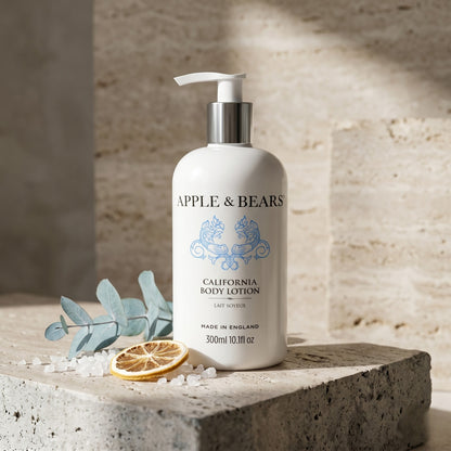Apple and Bears California Body Lotion 300ml on stone plinth with eucalyptus lemon and sea salt Aesop editorial lifestyle made in England