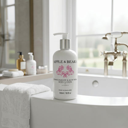 Apple and Bears Pomegranate and Aloe Vera Body Lotion 300ml on freestanding bath luxury spa bathroom made in England