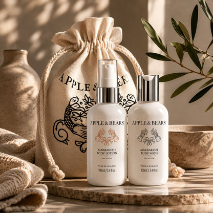 Apple &amp; Bears Marrakesh Body Lotion &amp; Body Wash Travel Gift Set 100ml/3.4 fl oz on travertine stone with olive branch beside riad courtyard pool, Made in England